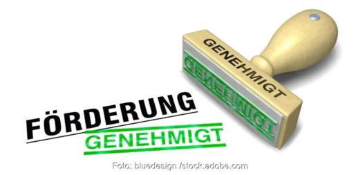 Im Bild ein Stempel mit der Aufschrift Förderung als Symbol für die neue Bundesförderung Aufbauprogramm Wärmepumpe (BAW).