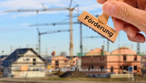 Häuser im Bau und Hand mit Stempel Förderung, die progres.nrw-Förderprogramme für Elektromobilität und Klimaschutztechnik werden fortgesetzt.