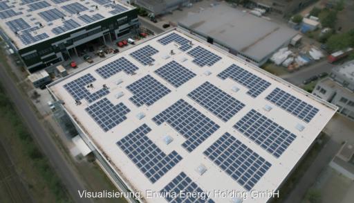 Luftaufnahme einer Gewerbeimmobilie in Dreieich mit einer visualisierten Photovoltaikanlage aus zahlreichen Modulen auf dem Flachdach.